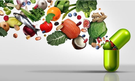 Antioxidant rich food pouring out of a capsule